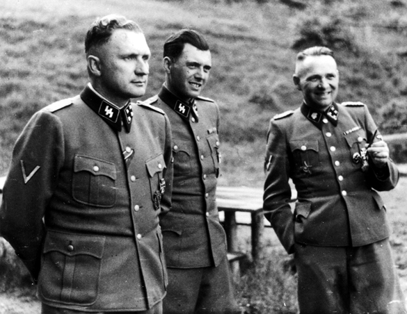 Summer 1944: Auschwitz SS officers resting. Center is Mengele, on his left is SS Major Richard Bӓr, commander of Auschwitz, on his right is SS Lieutenant-Colonel Rudolf Höss, founder of Auschwitz and architect of the destruction of the Hungarian Jews. (Photo: United States Holocaust Memorial Museum)