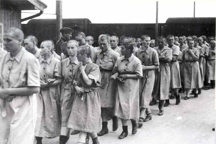 Hungarian Jewish women with shaved heads after the post-arrival baths. (Photo: Hungarian National Museum/YadVashem)