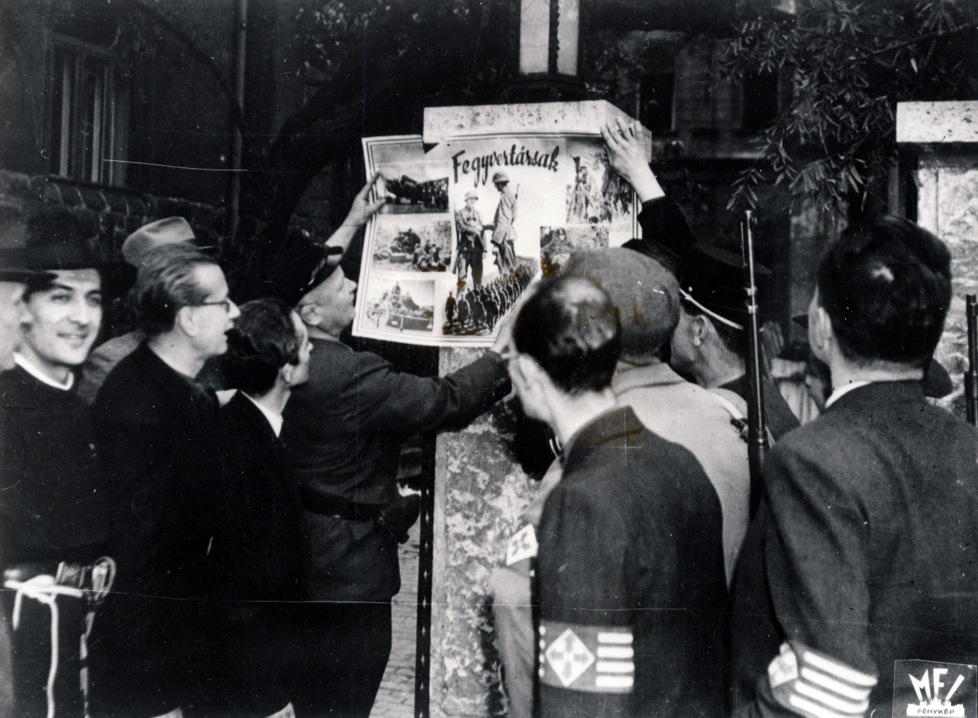 Arrow Cross Party servicemen, with András Kun in clerical garb on the left of the picture (Fortepan)
